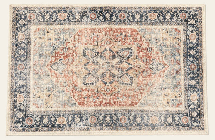 Terracotta and navy accent rug with a geometric woven pattern - Whats New Furniture Portland OR