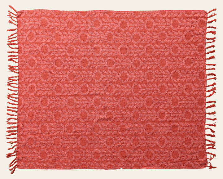 Woven Recycled Cotton Jacquard Throw with floral pattern and fringe in pink and red laid flat - throw by Creative Co-Op - Whats New Furniture Portland OR