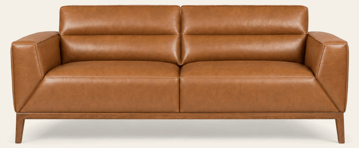 Oro top-grain leather sofa in camel on a white studio background - What’s New Furniture Portland
