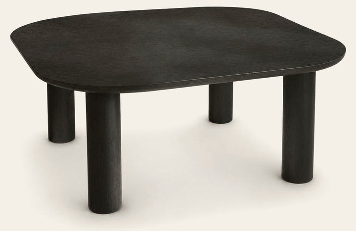 Monsun 31.5 inch square coffee table in black oak with four cylindrical legs, studio view
