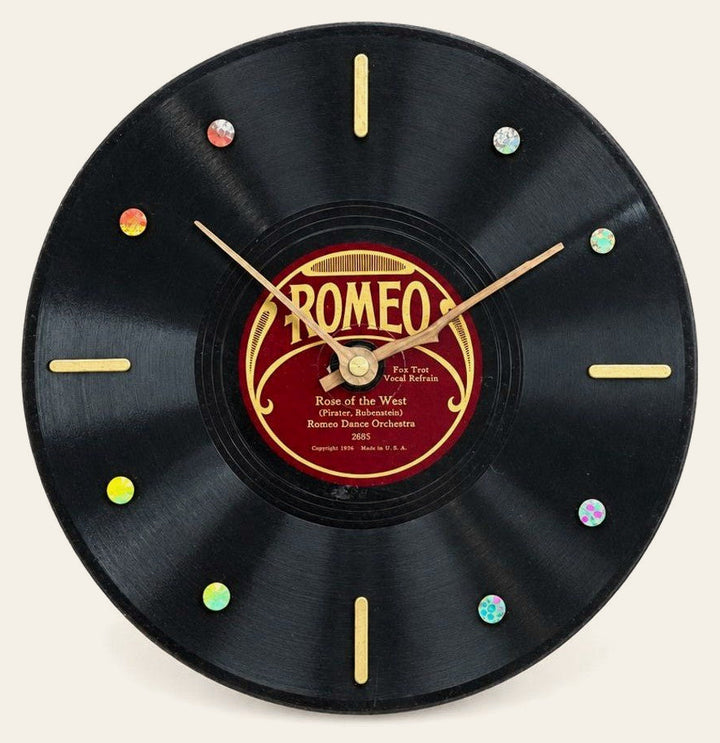 Black vintage vinyl clock with a Rose of the West face.