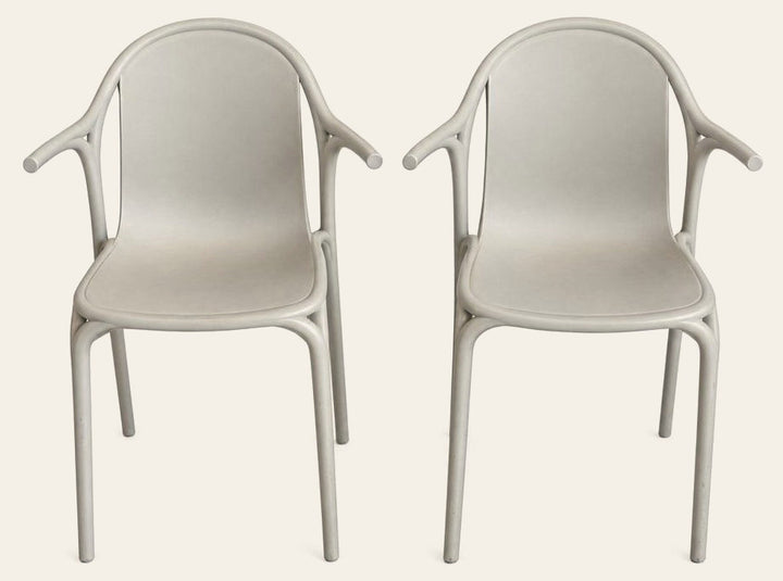 Light Gray geometric dining chairs with a pixel-cut molded shell by Vondom