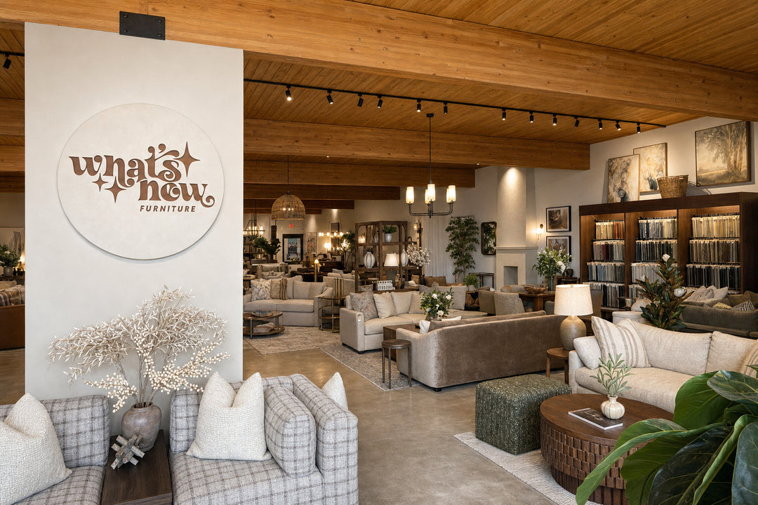 What's New Furniture brand wall inside the Cedar Mill furniture showroom