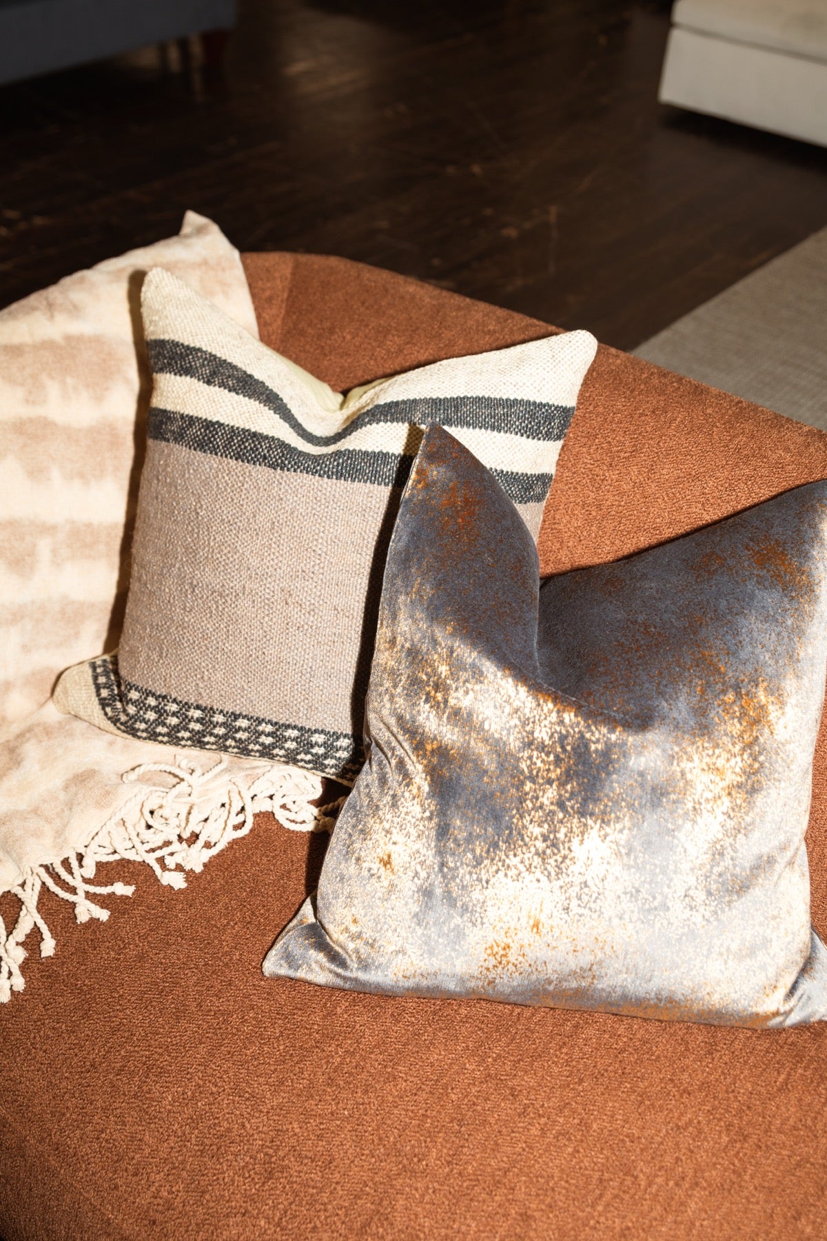 Curated accent pillows and textiles on sofa