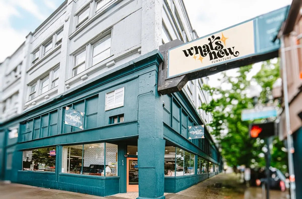 What’s New Furniture’s teal corner storefront at 439 SE Grand Avenue in Portland, with the What’s New sign hanging over the corner