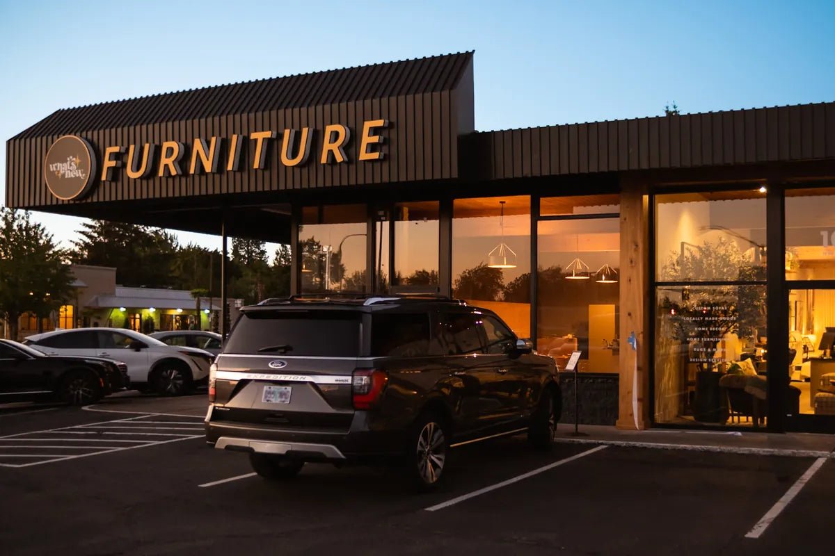 What's New Furniture Cedar Mill storefront on NW Murray Road at dusk